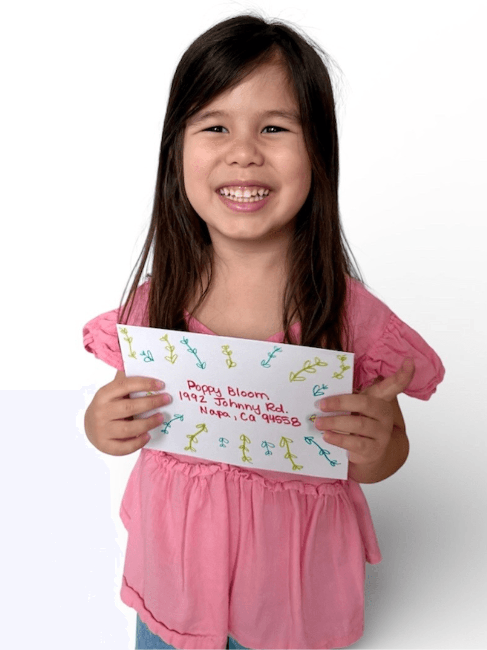 Colorful envelope with handwritten letter, doodles, and stickers